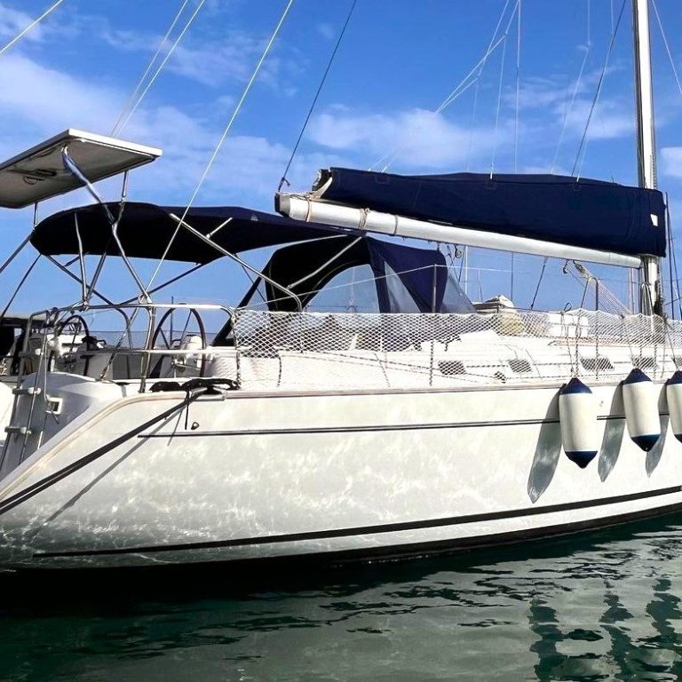 View of the interior of a boat with a clear canopy and wooden features.